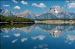 Grand Teton across Jackson Lake with Puffy Clouds